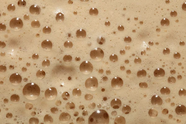 Frothy coffee background Royalty Free Stock Photos