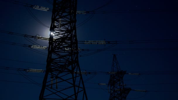 Electricity pylon and moon. — Stock Video