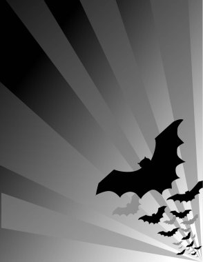 Halloween bats flying out at sunset. Copy space to add text for your haunted holiday party, announcement, flier, scrapbooks. 