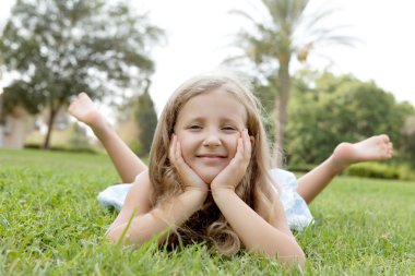 Happy blond girl on nature