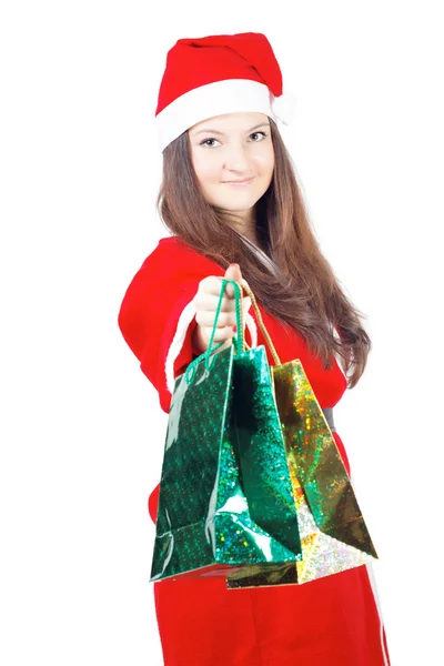 Pretty teen girl dressed as Santa gives gifts — Stock Photo, Image