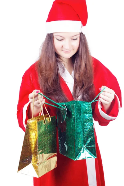 Bastante adolescente chica vestida como santa looks regalos — Foto de Stock