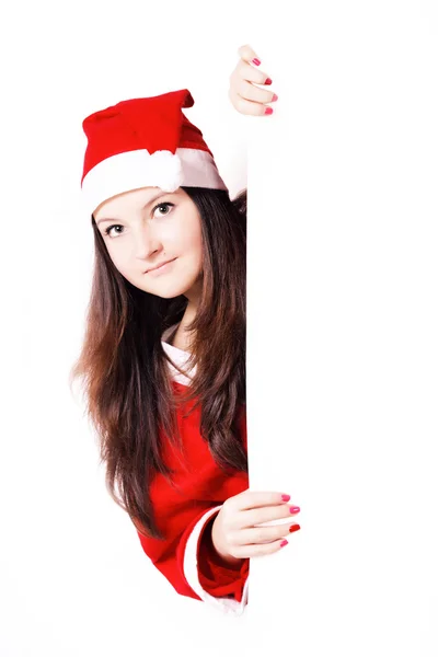 Pretty young girl dressed as Santa with a sign Royalty Free Stock Photos