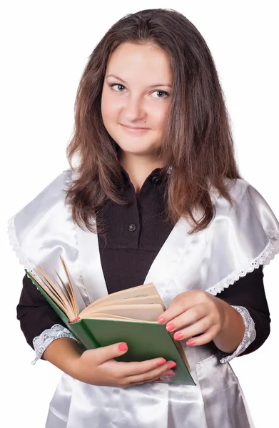 Linda estudante com um livro em suas mãos — Fotografia de Stock