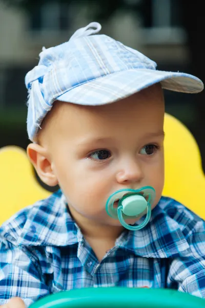 Portrait of a cute baby with pacifier — Stock Photo, Image