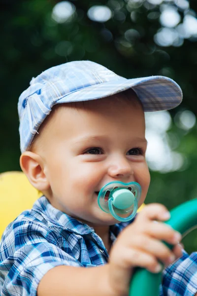 Portrait of a laughing baby with pacifier — Stock Photo, Image