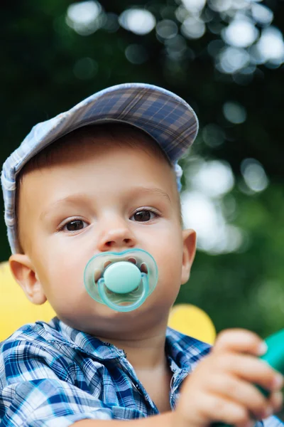 Portrait of a pretty baby with pacifier — Stock Photo, Image