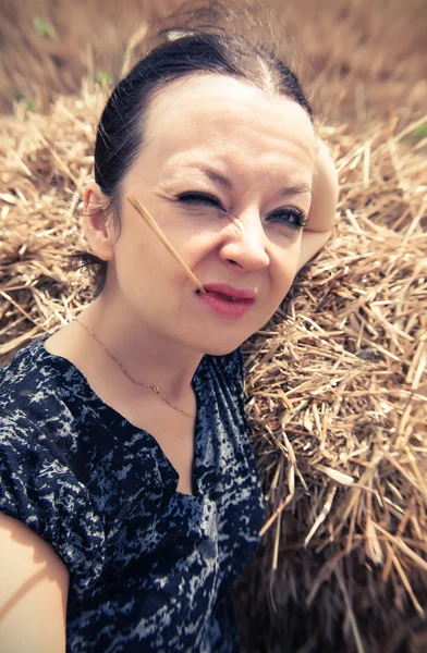 Funny portrait of a girl with straw — Stock Photo, Image