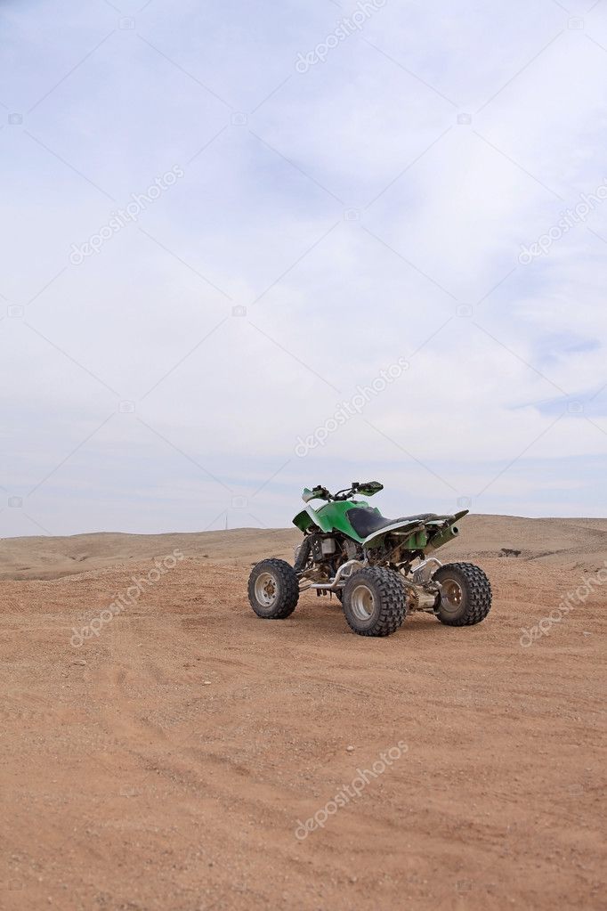 single quad bike in the desert