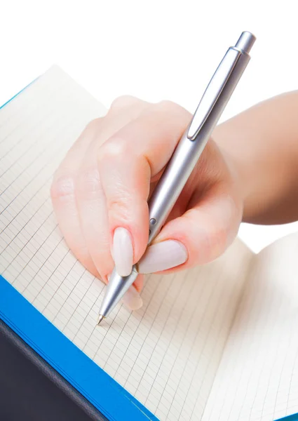 Main de femme avec un stylo écrit — Photo