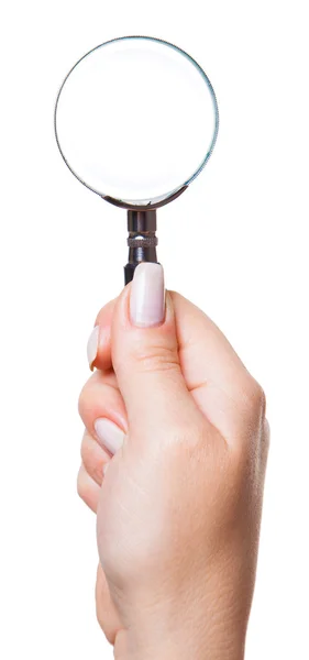 Magnifier in a female hand — Stock Photo, Image