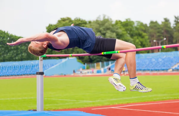Athlete jumps in height — Stock Photo, Image