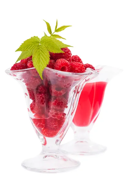 Glasses with juice and raspberries — Stock Photo, Image