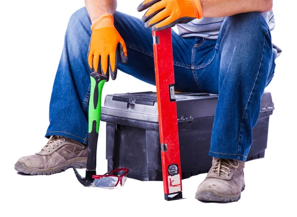 Worker sitting on toolbox — Stock Photo, Image