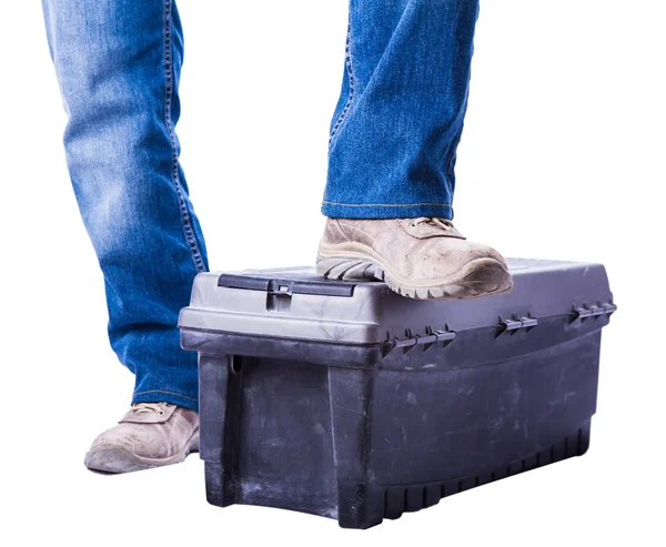 Worker put his foot on the toolbox — Stock Photo, Image