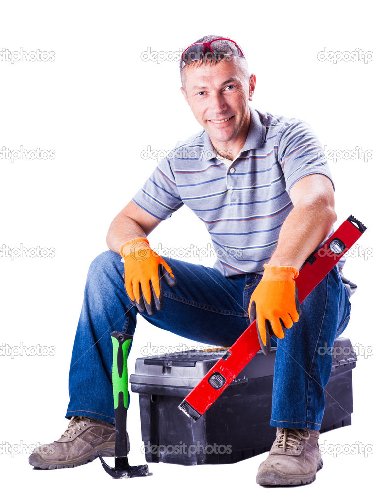 man sitting on a box with tools 