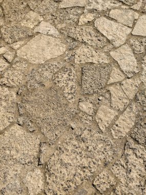 Kum taşından bir duvarın soyut arkaplan dokusu