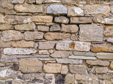 Kum taşından bir duvarın soyut arkaplan dokusu