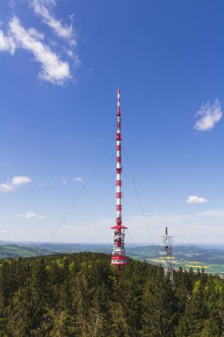Mobile and television transmitter Klet with blue sky. Czech republic