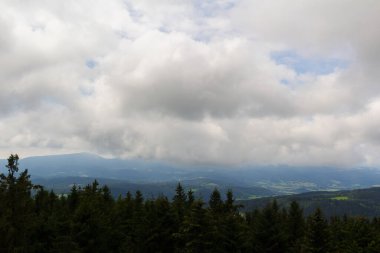 Aerial view to forest czech valley with dramatic storm cloud sky. Nature, hike background  