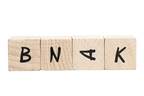 Woord bank verkeerd gespeld met houtblokken. — Stockfoto