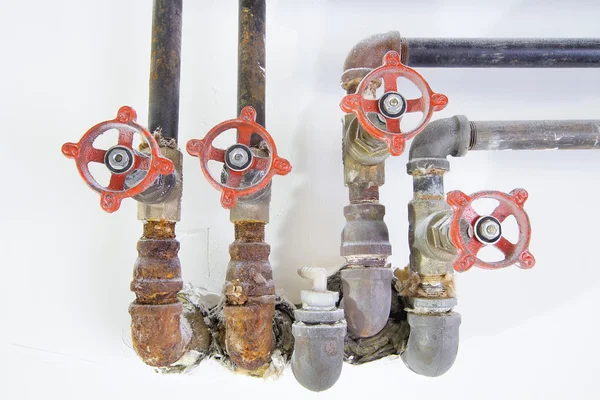 Old Plumbing Pipes with Valves Closeup Front — Stock Photo, Image