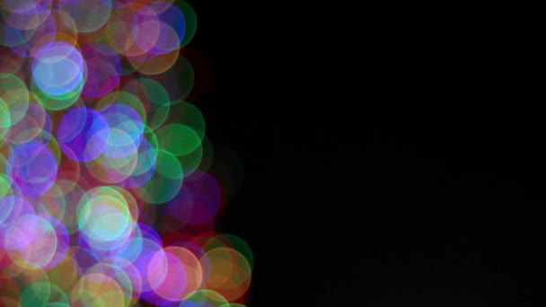 Brillante vacanza colorato Bokeh illuminazione su sfondo nero — Video Stock