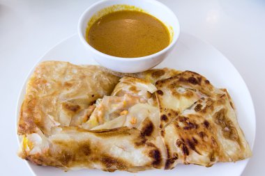 Indian Roti Prata with Curry Sauce clipart