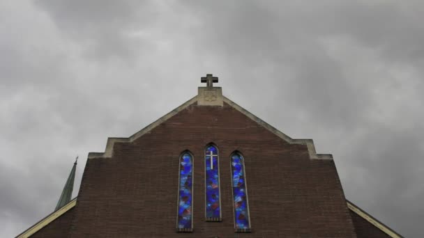 Dark Clouds Moving over a Church with Crucifix and Cobalt Blue Stained Glass in Portland Oregon Time Lapse 1920x1080 — Stock Video