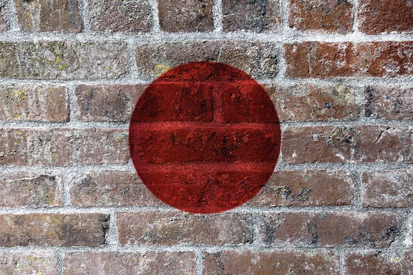 Japanse vlag op bakstenen muur achtergrond — Stockfoto