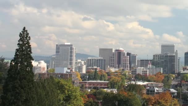 Portland Oregon Cityscape in Colorful Fall Autumn Season and Fast Moving White Clouds against Blue Sky with Panning Effect Timelapse 1920x1080 — Stock Video