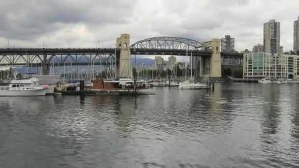 Vancouver BC Canada with Cambie Bridge Condominiums Buildings Moving Clouds and Water Transportation along English Bay Time Lapse 1920x1080 — Stock Video
