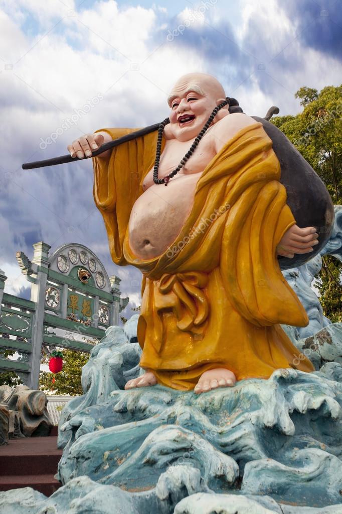 Ho Tai Laughing Buddha Statue at Haw Par Villa Stock Editorial Photo