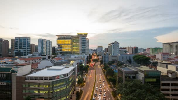BUGIS, SINGAPORE - MAY 25, 2014: Time lapse movie of sunset over Bugis area with moving traffic in Singapore. Bugis is a popular area with tourists and locals alike. It is a hotspot for entertainment — Stock Video