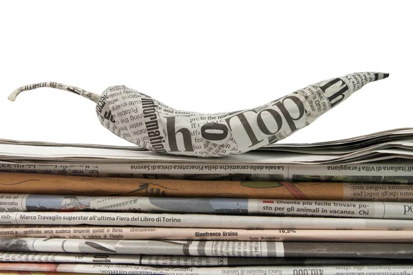 Krant peper op een stapel van krant — Stockfoto