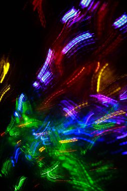 Turuncu Bokeh 'in soyut geçmişi, yeni yıl konsepti. Bulanık odak içinde küçük ışıklar