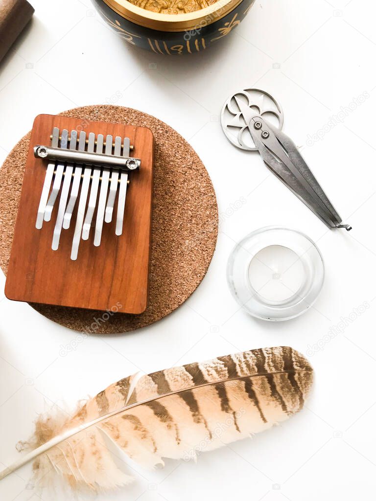 Ethnic musical background, Tibetan musical instruments on a white background, top view.place for text