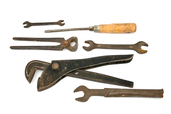 Adjustable spanner with old tools Stock Image