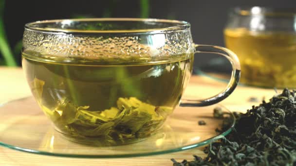 Chá solto e xícara de chá — Vídeo de Stock