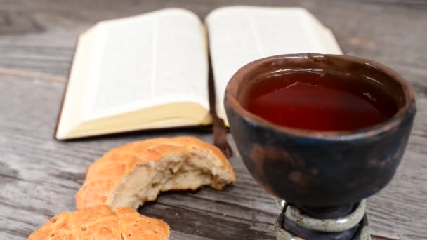 Bible with chalice and bread — Stock Video