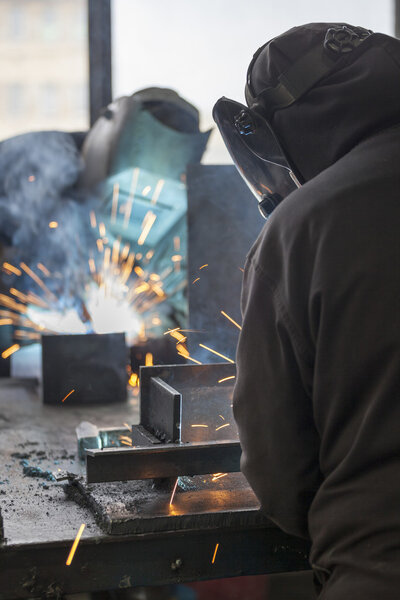 Industrial workers welding