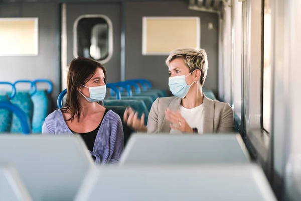 Couple Friends Wearing Mask Nicely Talking While Traveling Train — Stock Photo, Image