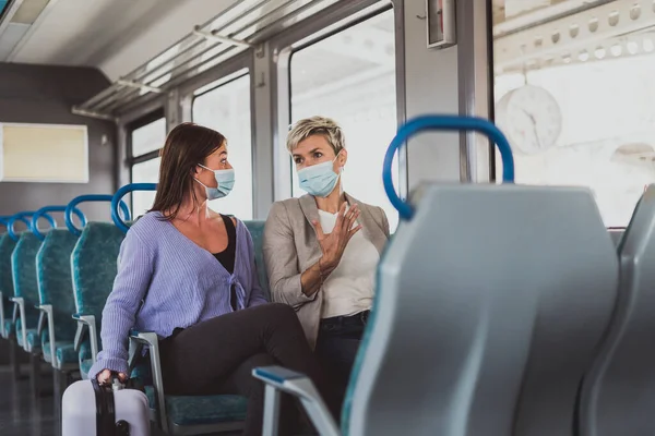 Couple Friends Wearing Mask Nicely Talking While Traveling Train — Stock Photo, Image