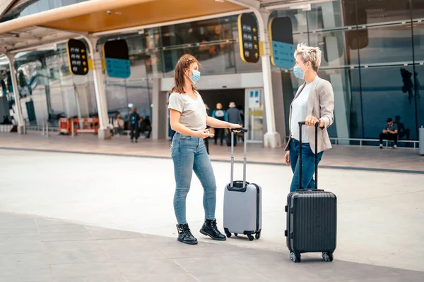 Women Protective Masks Luggage Waiting Front Airport — Stock Photo, Image