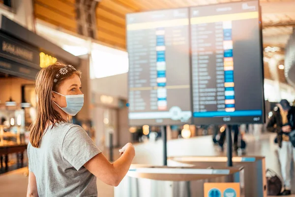 Young Woman Wearing Mask Information Board Timetable Airport — Stock Photo, Image