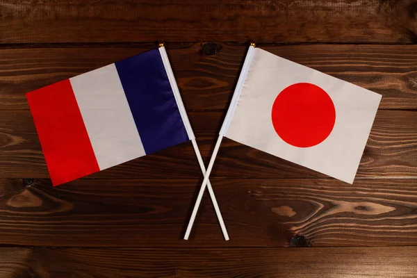 Bandiera Della Francia Bandiera Del Giappone Incrociate Tra Loro Immagine — Foto Stock