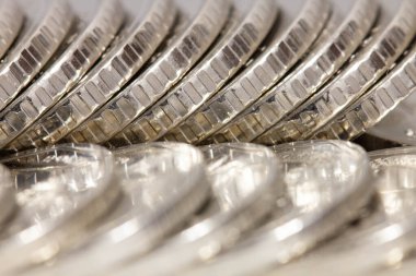Lots of White coins in a row. Beautiful money background. Coins background. Financial concept. Business concept. Image for the inscription. Copy space for text. Close-up