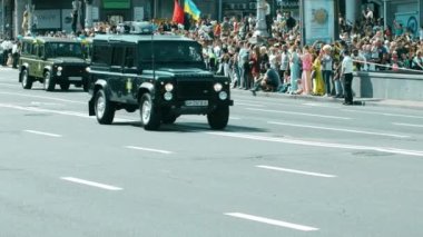 Kyiv, Ukraine 08.24.2021 Military armored vehicles Land Rover, KRAZ, Hummer HMMWV. Military highly mobile multi-purpose wheeled vehicle. Armed Forces of Ukraine. Military SUVs. War in Ukraine