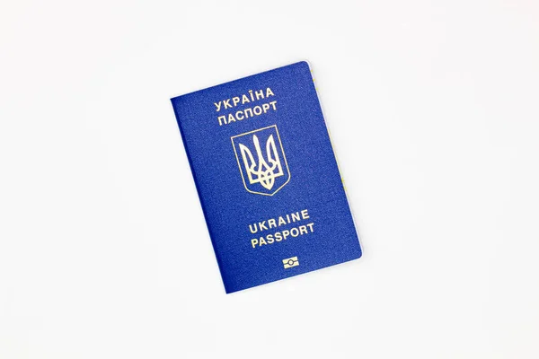Passport of Ukraine. The cover of the State document of the foreign Ukrainian Passport with the coat of arms of Ukraine on a white background with an electronic chip. Isolated. Image at an angle