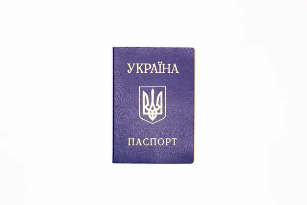 Passport of Ukraine. The cover of the State document of the internal Ukrainian Passport with the coat of arms of Ukraine in blue on a white background. Top view. Close-up